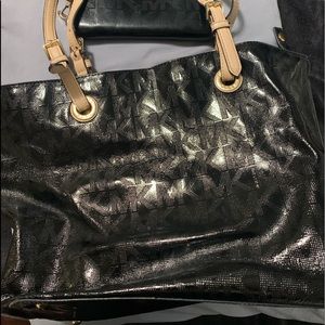Black shiny Michael Kors Purse and matching wallet with beige handles gold parts